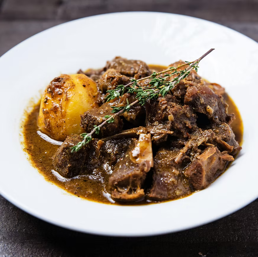 Caribbean curry goat prepared by Come Eat With Me